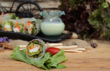 Salad rolls vegetable with tuna and crab stick.