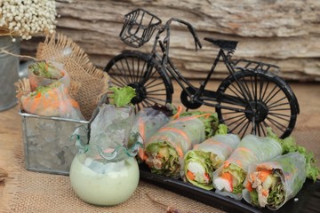 Salad rolls vegetable with tuna and crab stick.