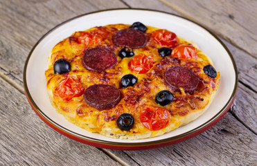 hot homemade pizza  heart with cheese, tomatoes, olives