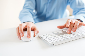 Men office worker typing on the keyboard