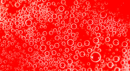 drops of honey on a red background
