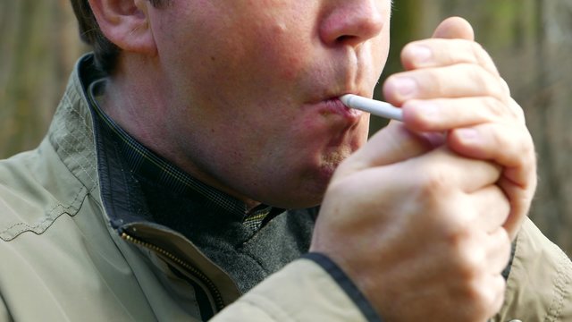 Tobacco smoker man male smokes a cigarette, person in nicotine poison blue smoke