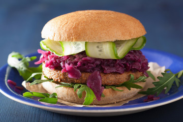 veggie soy burger with pickled red cabbage cucumber arugula