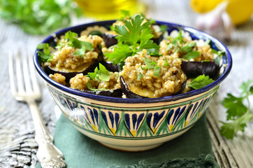 Fried eggplants slices with walnut and garlic sauce.
