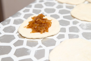 cooking cakes of the dough in the kitchen