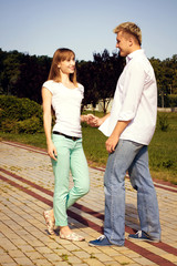 Fototapeta premium Happy young couple on the nature. Couple kissing happiness fun.