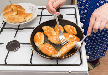 Food patties in a frying pan