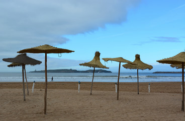 Essaouira, Morocco -  January 6, 2016: Beach umbrellas in Essaouira after the rain