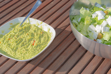 Aerial view healthy low carb salad and homemade spicy guacamole