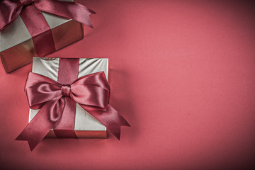 Gift boxes on red background horizontal image holidays concept