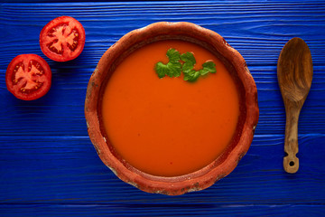 Tomato sauce on clay dish and dark wood