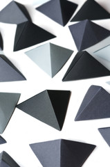 Monochrome black and gray tetrahedrons background. Great for using in web.