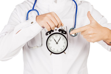Medical doctor in white coat with stethoscope holding out an ala