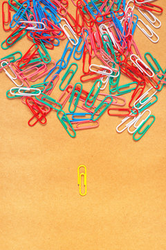 Flat lay colorful paper clips arrangement, concept of racism