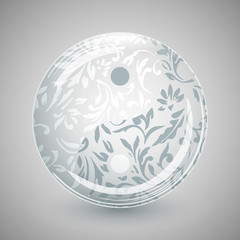 Yin Yang in glass sphere with floral pattern