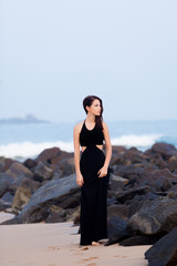 Portriat of Young redhead woman in a black dress