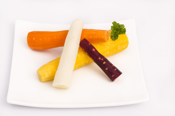 raw yellow, white, orange, red carrots