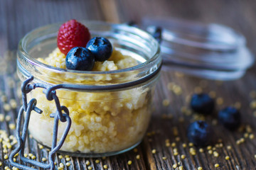 Millet porridge with milk and berries