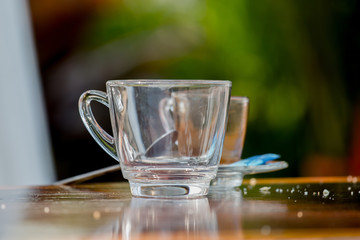 glass small on a wooden table Dirty.