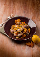 roasted rabbit with vegetables and dried apricot
