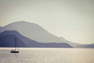 Fototapeta na wymiar Sea, mountains and a fishermen boat.