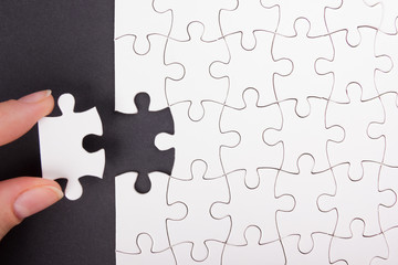 Missing jigsaw puzzle pieces. Business concept. Compliting final task