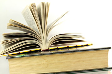 Stack of books isolated closeup on white background