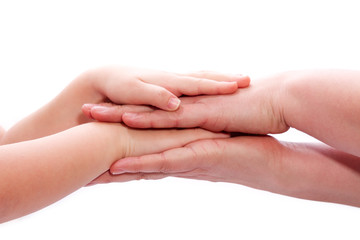 Familie legt H&auml;nde aufeinander