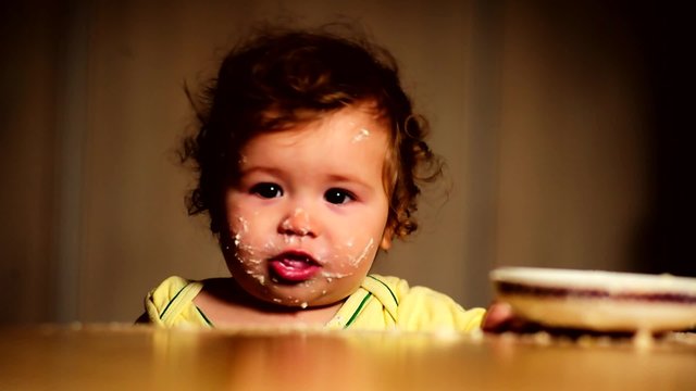 Mom feeds the baby with finger