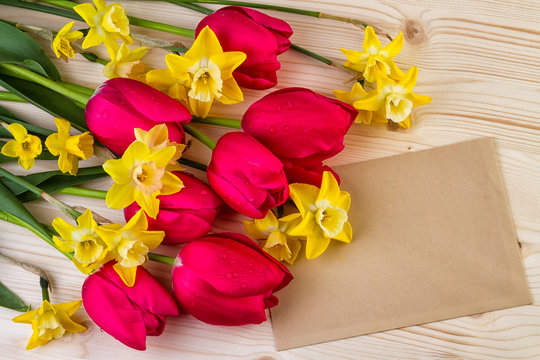Spring flowers with paper sheet text space