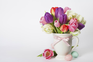Beautiful tulips bouquet and easter eggs