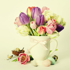 Beautiful tulips bouquet and easter eggs