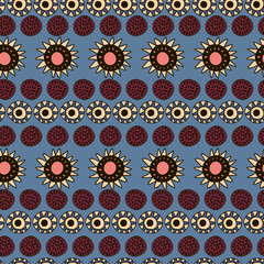 Seamless pattern with sunflowers and suns on blue background.