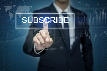 Businessman hand touching SUBSCRIBE button on virtual screen