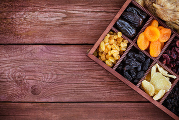Assorted dried fruits in wooden box
