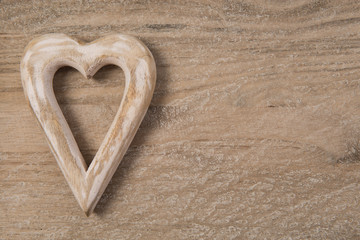 Wooden hart on wooden background