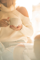 Two girls having fun while drinking coffee