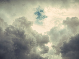 gray clouds in blue sky background, vintage filtered style