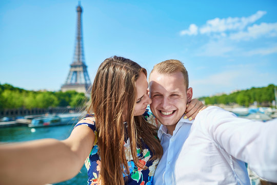 Romantic couple taking selfie in Paris