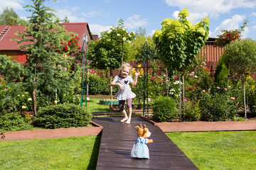 girl dancing in beautiful blooming garden