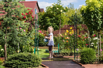 girl walking on pathway in beautiful garden