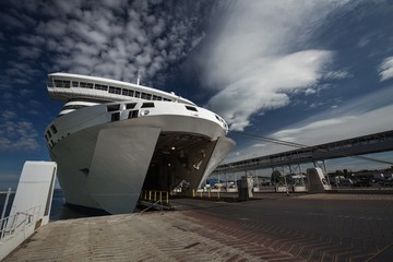 Fototapeta premium Ferry ship boarding at harbor with an empty car deck