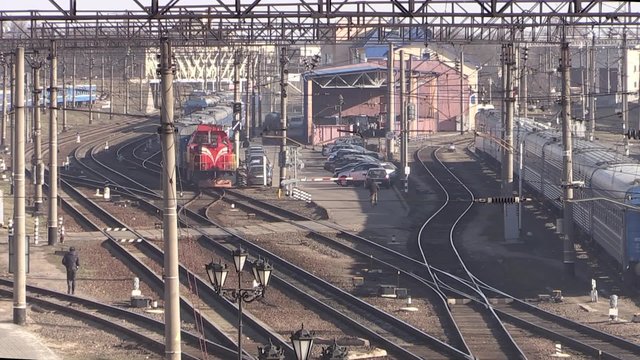 Many railroad tracks and trains
