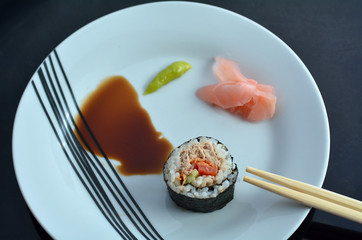 Top view of one Makizushi sushi fresh maki roll served on a plat