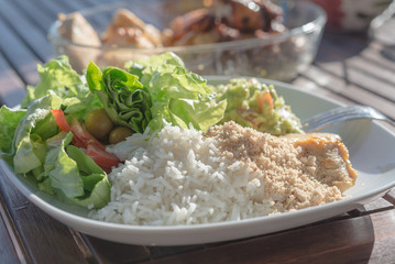 Aerial view healthy low fat meal with salad rice guacamole