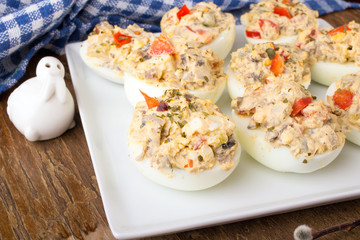stuffed eggs with peppers, mushrooms and herbs - selective focus