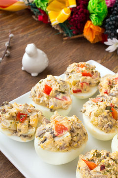 stuffed eggs with peppers, mushrooms and herbs - selective focus
