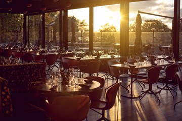 Fototapeta na wymiar Restaurant interior at a sun set