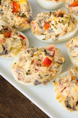 stuffed eggs with peppers, mushrooms and herbs - selective focus