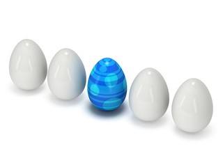 Blue easter egg in a row of the white eggs